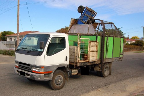 Low-emission van and crew on a Leyton street collecting business waste