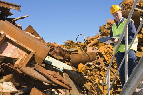 Supervisor reviewing safety checklist during waste transfer